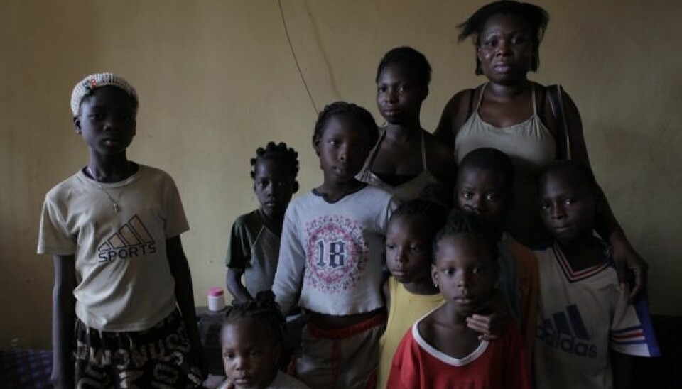 Upon their return from Europe, Nigerian victims of sex trafficking suddenly end up being responsible for taking care of their relatives, because it’s assumed that they have made lots of money up there. Pictured is one of the repatriated women, 'Esther', with her five children and four other children in her family. (Photo: Janus Metz)
