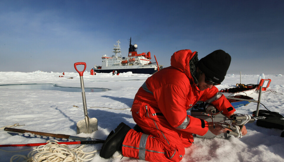 A researcher preparing sensors that measure the sea ice. (Photo: Karl Attard, NIOZ/Alfred Wegener Institute)