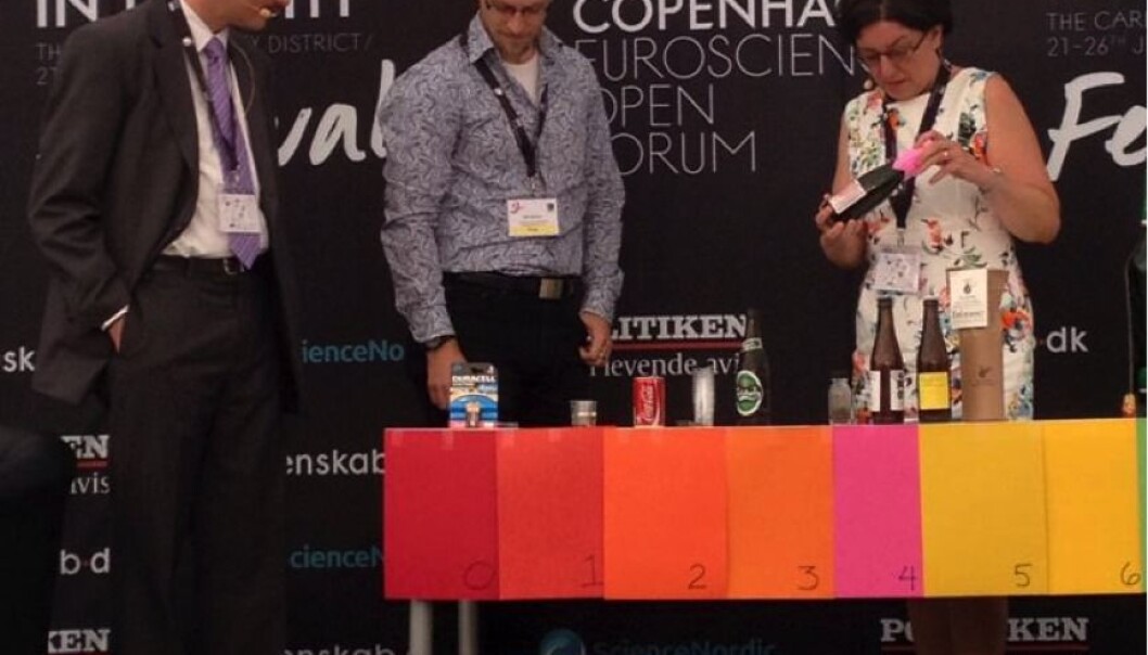 Bottles of beer are placed on the pH-scale. Jürgen Wendland (left) explains how the pH of beer correlates to the pH of other substances such as Coca cola and baking powder. Bottles of beer are placed on the pH-scale. Jürgen Wendland (left) explains how the pH of beer correlates to the pH of other substances such as Coca cola and baking powder.