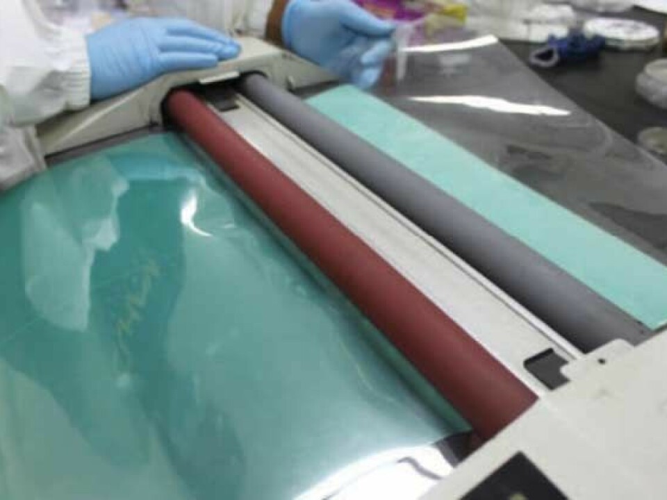 South Koreans rolling out a 30-inch sheet of graphene. (Photo: Byung Hong Hee)