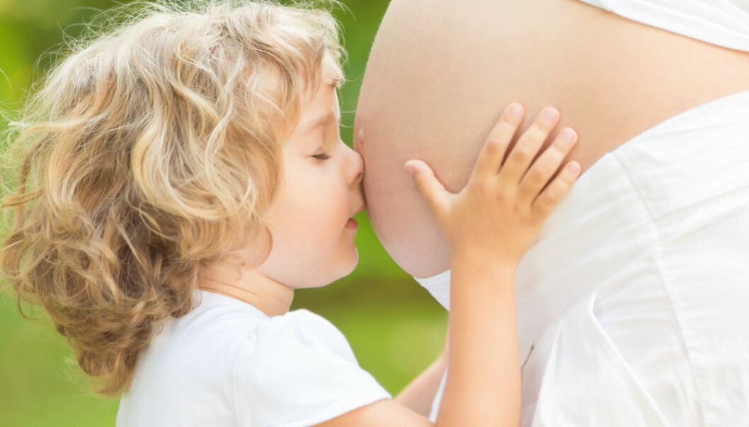 http://www.shutterstock.com/pic-126832919/stock-photo-child-kissing-belly-of-pregnant-woman-against-spring-green-background.html