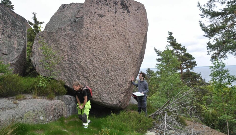 Archaeologists explore the island of Blå Jungfrun, which is littered with huge boulders and steep cliffs. The island has been associated with tales of witchcraft, curses, and supernatural powers for centuries. (Photo: Kenneth Alexandersson)
