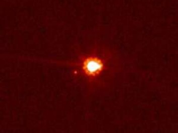 The dwarf planet Eris is bigger and more massive than Pluto, and moves in a highly elliptical orbit far from the Sun and Earth. Eris has a moon, Dysnomia, which shows up as a small dot to the left of the dwarf planet. (Photo: NASA, ESA and M. Brown from Caltech) The dwarf planet Eris is bigger and more massive than Pluto, and moves in a highly elliptical orbit far from the Sun and Earth. Eris has a moon, Dysnomia, which shows up as a small dot to the left of the dwarf planet. (Photo: NASA, ESA and M. Brown from Caltech)