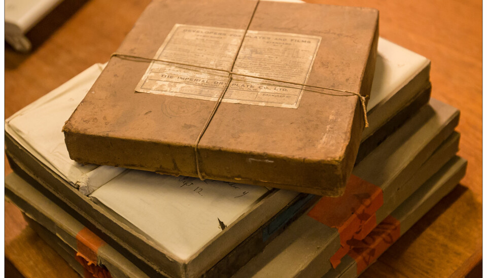 Astronomer Holger Pedersen found some cardboard boxes in the basement of the Niels Bohr Institute, Copenhagen, Denmark. The boxes were full of photographic plates that were up to 120 years old. (Photo: Niels Bohr Institute)