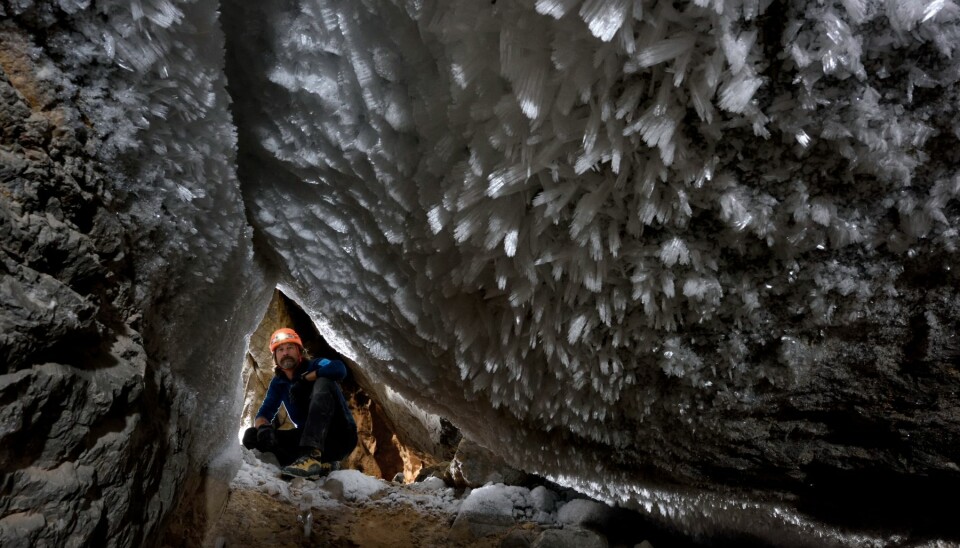 Team member Chris Blakeley looks up at frost formations in the Crystal Palace cave. (Photo: Robbie Stone).