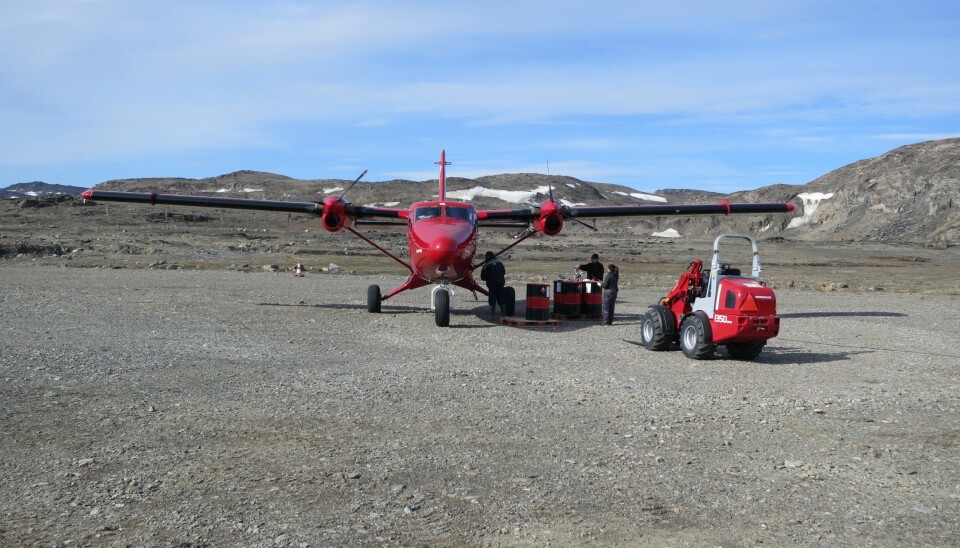 Our small twin-engine plane is refuelled at the weather station Danmarkshavn on the east coast of Greenland, en route to Station Nord base camp. (Photo: Kristian Svennevig)