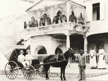 Doctor ZWergius with his wife outside their house in Frederiksted on the island of St. Croix in the Caribbean. Also pictured are their driver, Jo, and two maids, Lauretta and Elin. (Photo: Holger Knudsen, M/S Maritime Museum)
