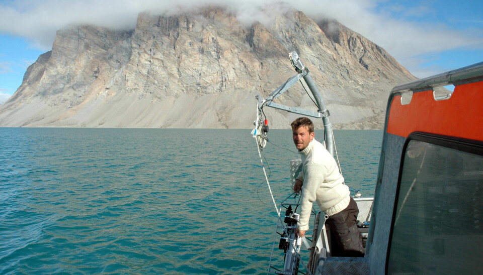 Marine biologist Mikael Sejr from Aarhus University measures temperature and salinity in Young Sound, Northeast Greenland, for the GEM database. (Photo: Mikael Sejr)