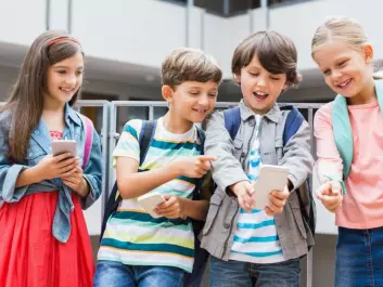 Where breaktime is taken over by smartphones and tablets, children lose the experience of playing outdoors. (Photo: Shutterstock)