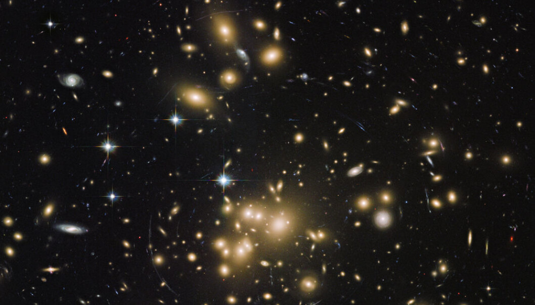 The Abell 1689 cluster galaxy contains about a thousand galaxies and trillions of stars. By studying images of galaxy clusters, scientists have calculated that dark matter makes up approximately 23 per cent of all matter and energy in space (Credit: NASA/ESA/STScI/AURA/Dominion Astrophysical Observatory/JHU/J. Blakeslee and H. Ford) The Abell 1689 cluster galaxy contains about a thousand galaxies and trillions of stars. By studying images of galaxy clusters, scientists have calculated that dark matter makes up approximately 23 per cent of all matter and energy in space (Credit: NASA/ESA/STScI/AURA/Dominion Astrophysical Observatory/JHU/J. Blakeslee and H. Ford)