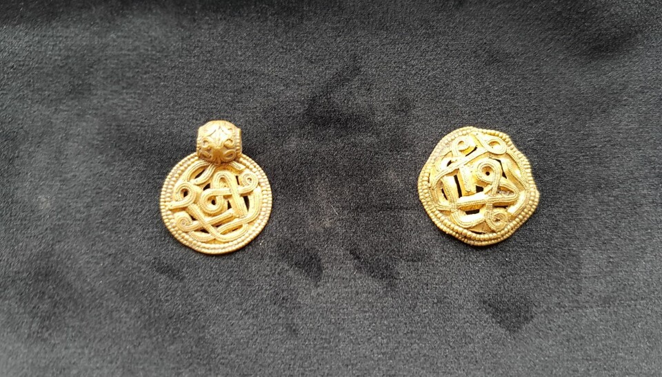 Two bracteates that must have belonged to a wealthy woman of high social status. They are small thin gold discs with an eyelet to be worn on a string or chain around the neck. (Photo: The Vejle Museums)