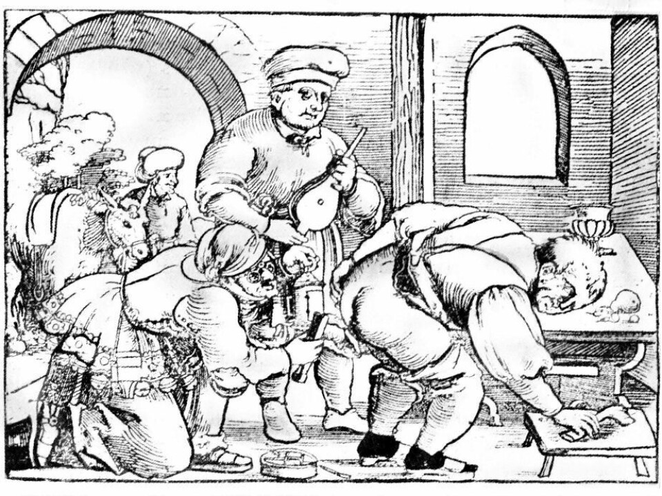 Cauterization of haemorrhoids. The surgeon holds a lamp in his left hand and an iron or forceps in his right. His assistant holds the bellows for the red-hot coals in the brazier on the floor. The patient helps by pulling his left buttock aside. In the gateway is the surgeon’s mount, so that he can easily get away. (Image: German woodcut 15th century).