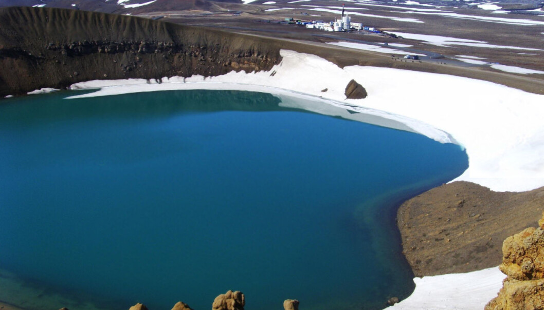 The Tyr Rig, seen in the background, drilled the hole at so IDDP-1 near the edge of the crater Víti, which is now inundated with water. Víti means Hell in Icelandic. (Photo: IDDP) The Tyr Rig, seen in the background, drilled the hole at so IDDP-1 near the edge of the crater Víti, which is now inundated with water. Víti means Hell in Icelandic. (Photo: IDDP)