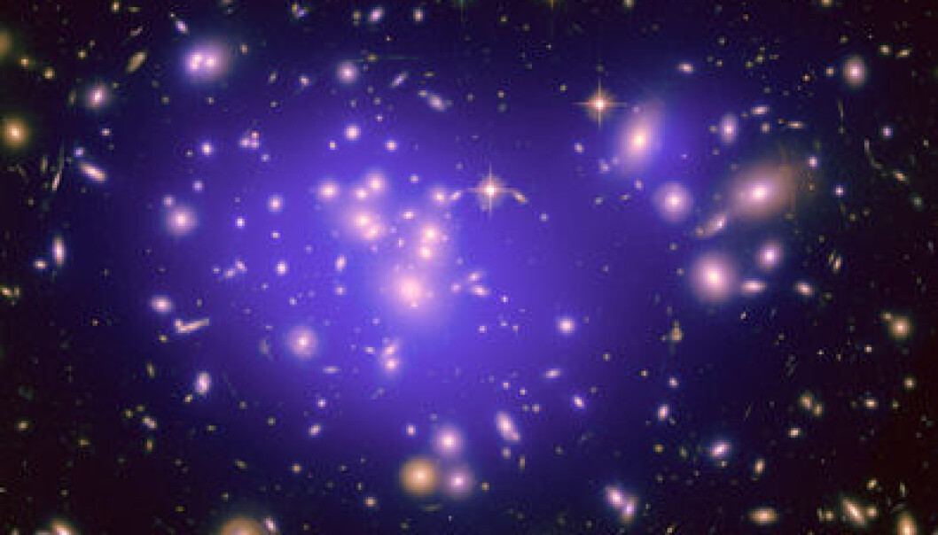 The light from the centre of distant galaxy clusters undergoes a gravitational red-shift as it travels through the cluster. The size of the red-shift is in perfect accordance with Einstein’s general theory of relativity. (Photo: NASA, ESA, E. Jullo (Jet Propulsion Laboratory), P. Natarajan (Yale University), and J.-P. Kneib (Laboratoire d'Astrophysique de Marseille, CNRS, France)) The light from the centre of distant galaxy clusters undergoes a gravitational red-shift as it travels through the cluster. The size of the red-shift is in perfect accordance with Einstein’s general theory of relativity. (Photo: NASA, ESA, E. Jullo (Jet Propulsion Laboratory), P. Natarajan (Yale University), and J.-P. Kneib (Laboratoire d'Astrophysique de Marseille, CNRS, France))