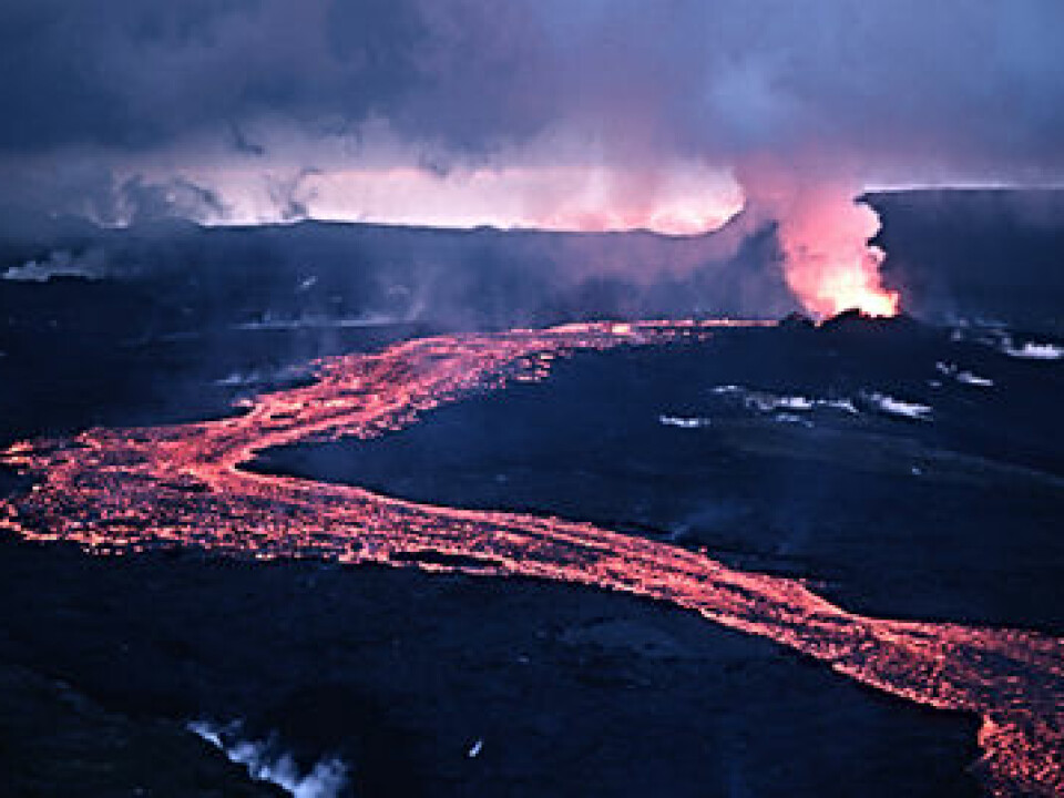 Lava flowing out of rock fractures at Krafla in 1984, towards the end of the phase when volcanic activity in the area threatened to halt the construction of the power plant.  (Photo: Michael Ryan, US Geological Survey)