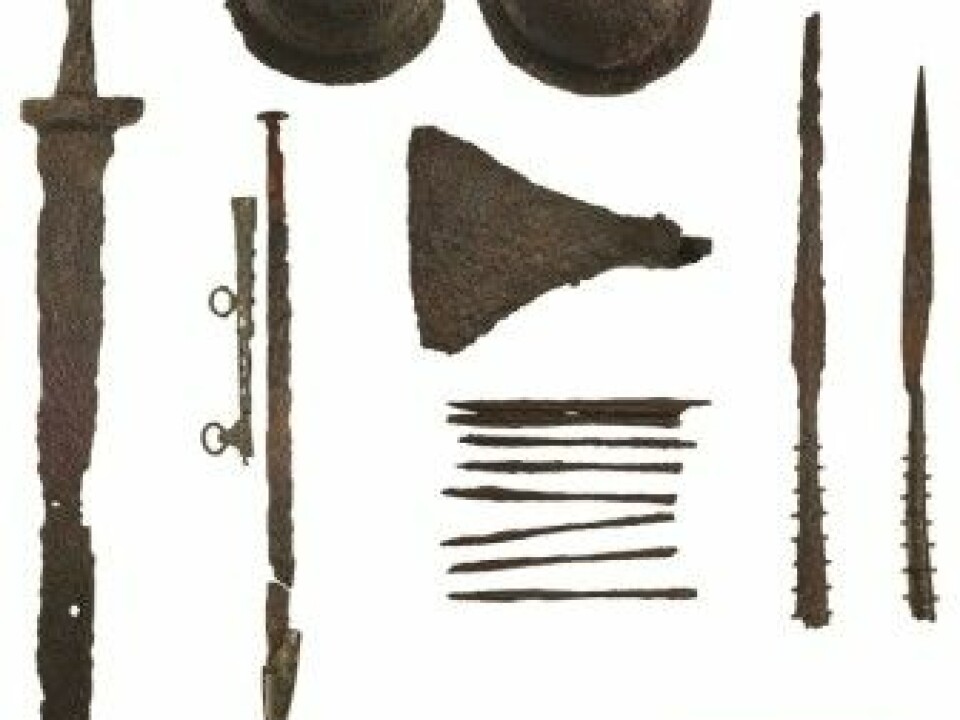 The weapons found in the grave, including swords, shields and 25 arrows. (Picture: Christer Åhlin, Swedish History Museum / Antiquity 2019)