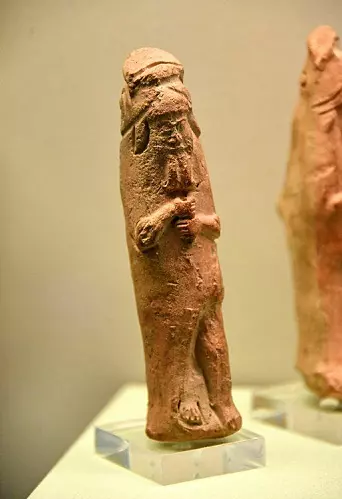 Figurine of a mythological sage wearing a fish cloak.