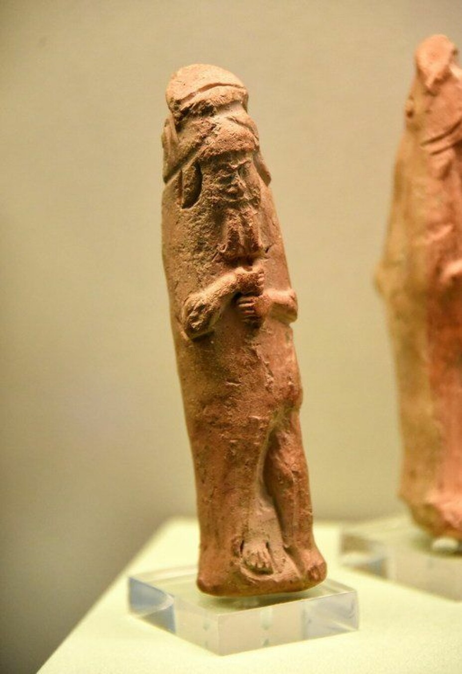 Figurine of a mythological sage wearing a fish cloak.