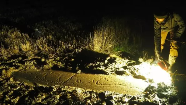 Three guys with torches have found almost 600 new rock carvings in their spare time